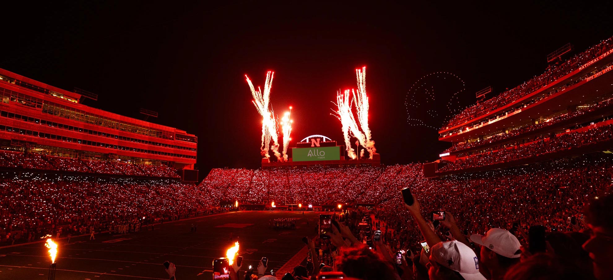 Memorial Stadium illuminated at night