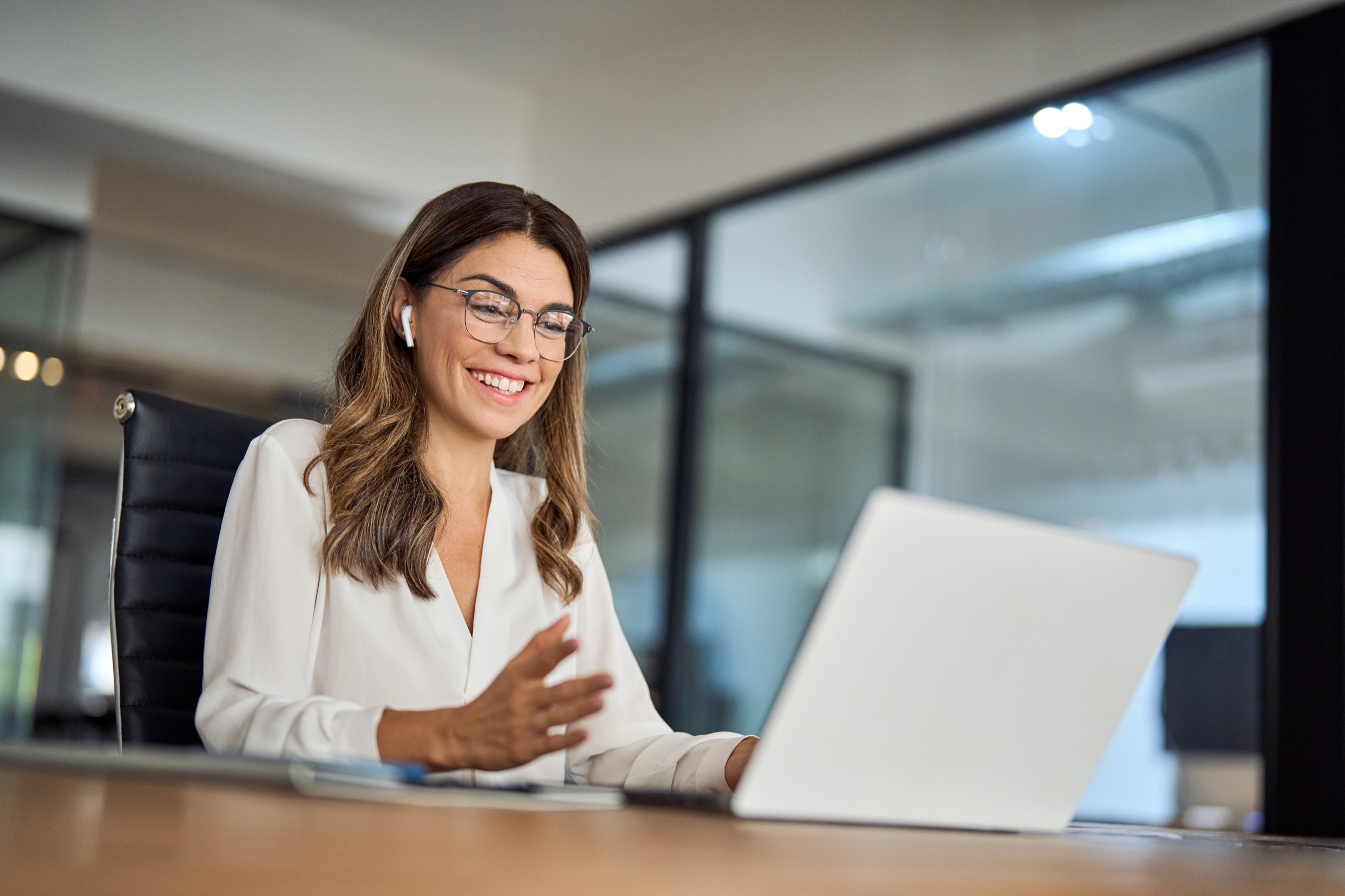 Business professional using Microsoft Teams Voice on a laptop