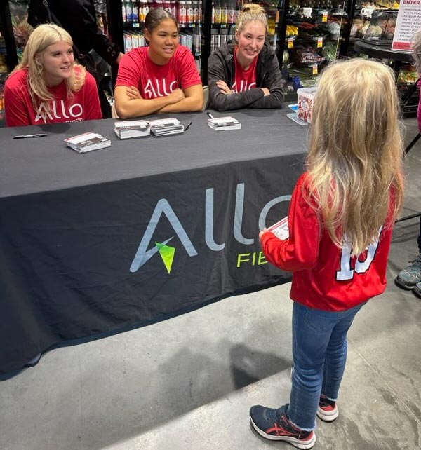 ALLO athletes Nicklin Hames,          Kennedi          Orr and Madi          Kubik with a fan