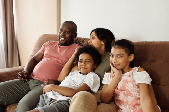 Family watching their favorite show