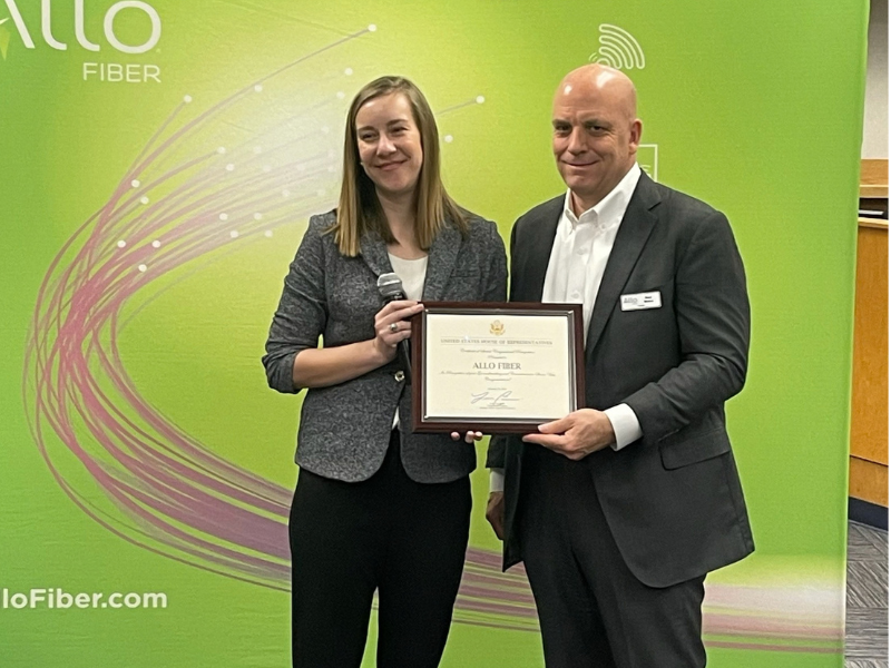 Brad Moline receiving award on behalf of ALLO