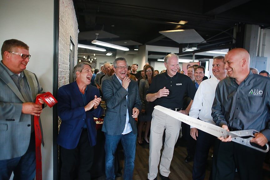 Ribbon cutting at ALLO office