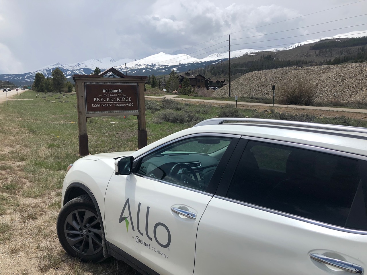 Breckenridge entry board with car having allo sticker on it