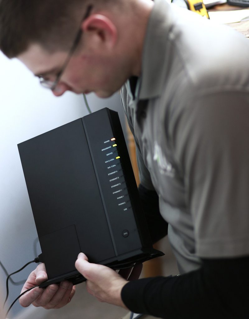 Man connecting internet router