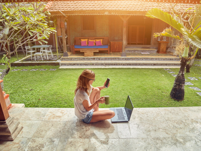 A person sitting outside using ALLO Fiber Outdoor Wi-Fi